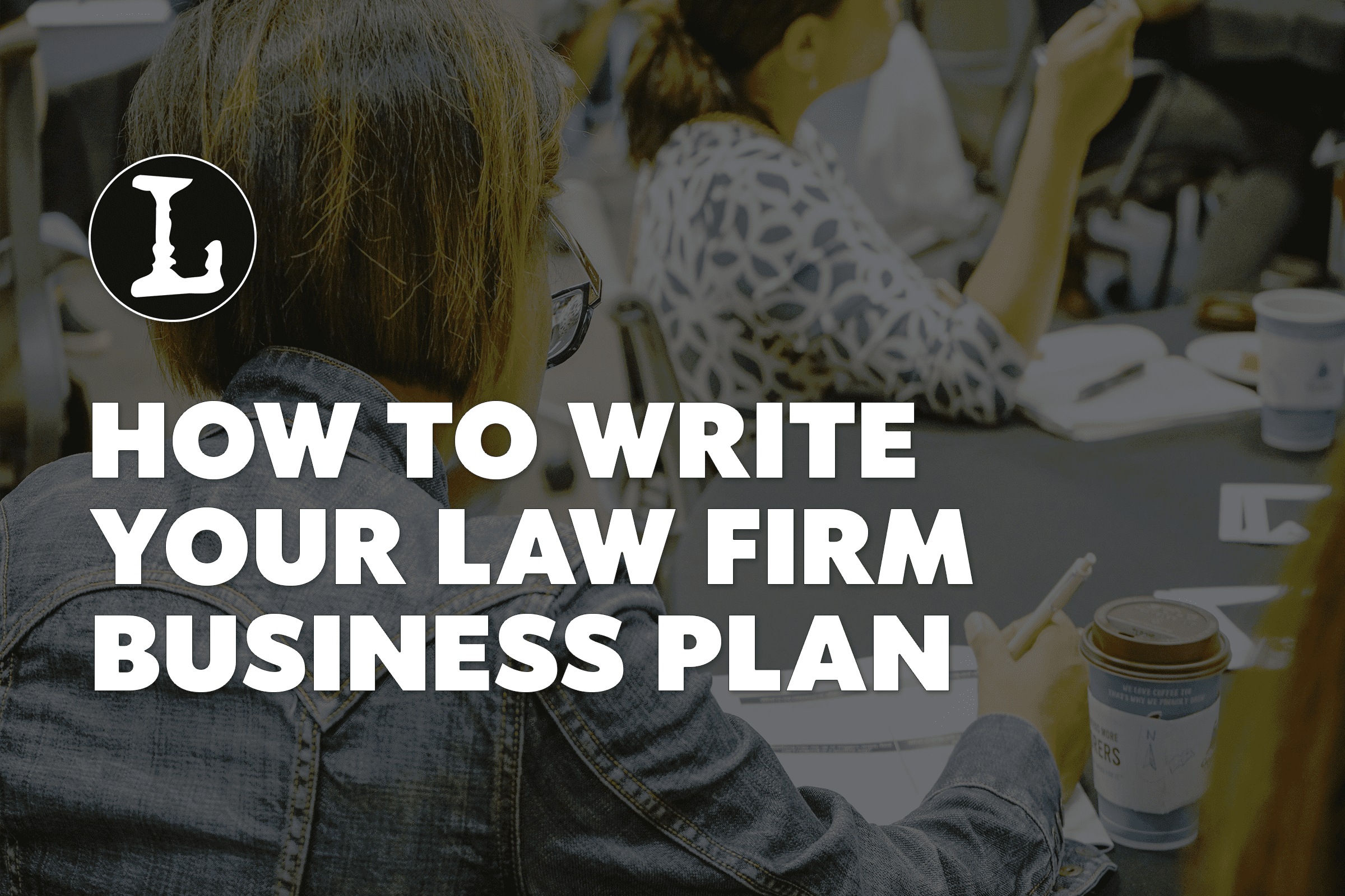 Two people at a table, discussing, with the words How to Write Your Law Firm Business Plan overlayed over the image