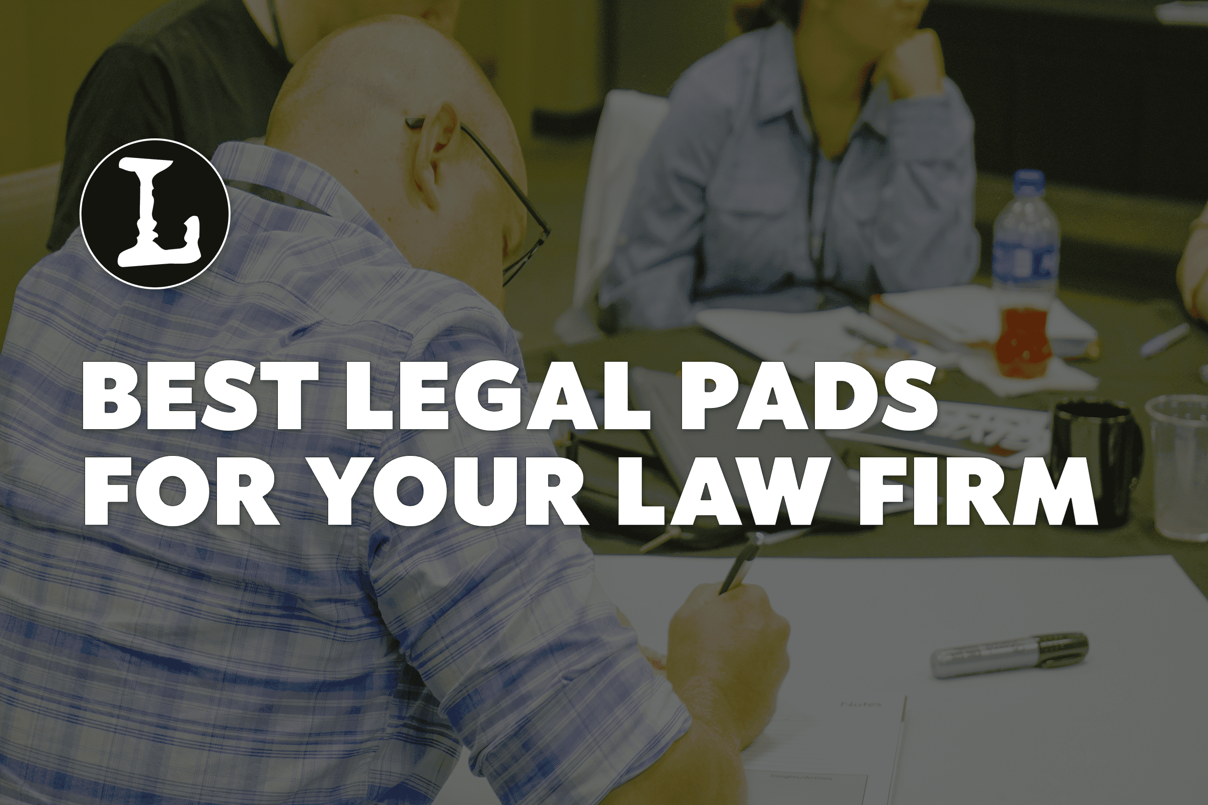 Person writing with the words Best Legal Pads for your Law Firm overlayed