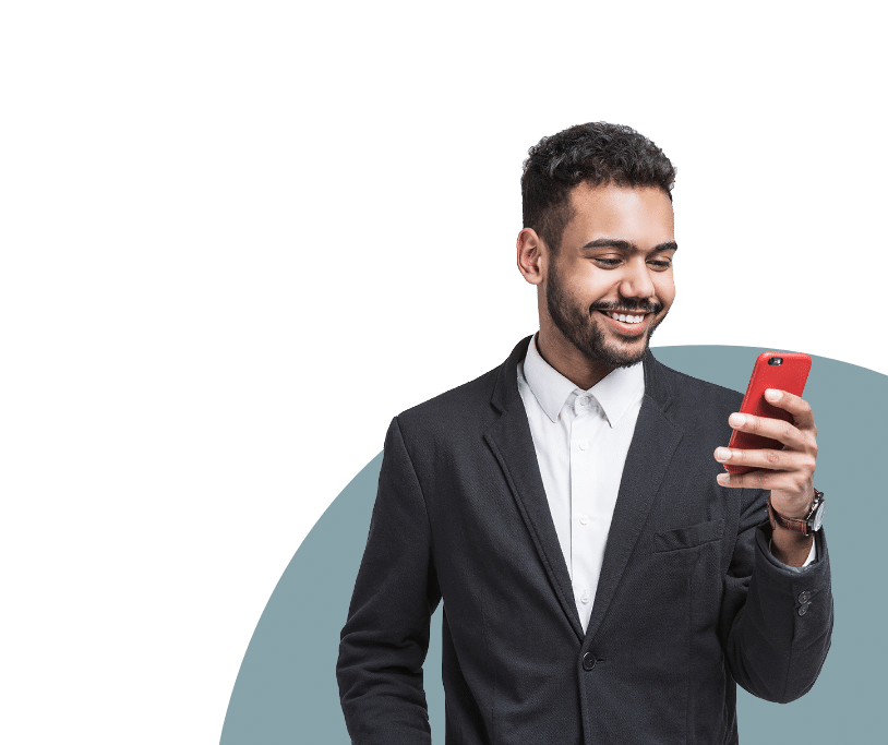 Man looking at his cell phone and smiling