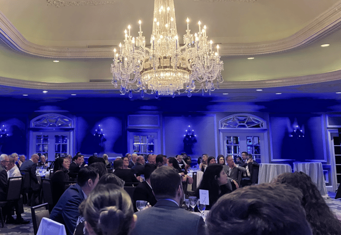 Legal Tech Awards attendees at tables in a ballroom.